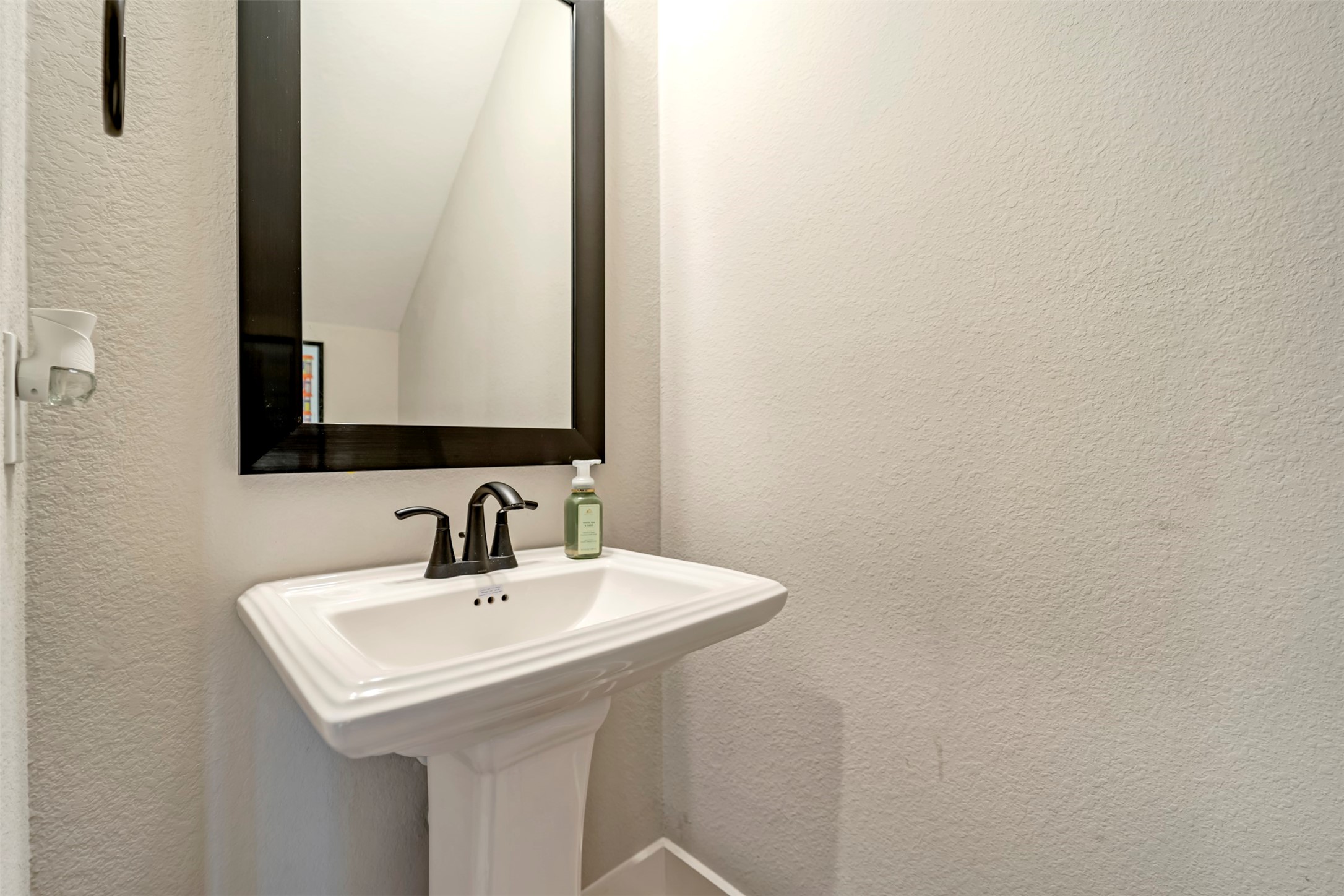 5209 Carters Bank Avenue Houston, TX 77091 - Photo 13 of 24 a bathroom with a sink and a mirror