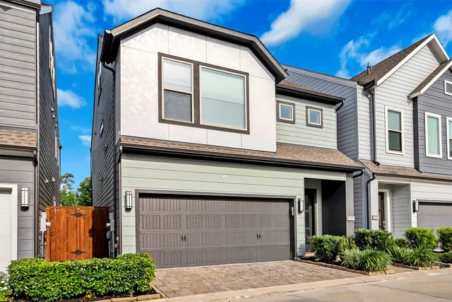 a front view of a house with a garage