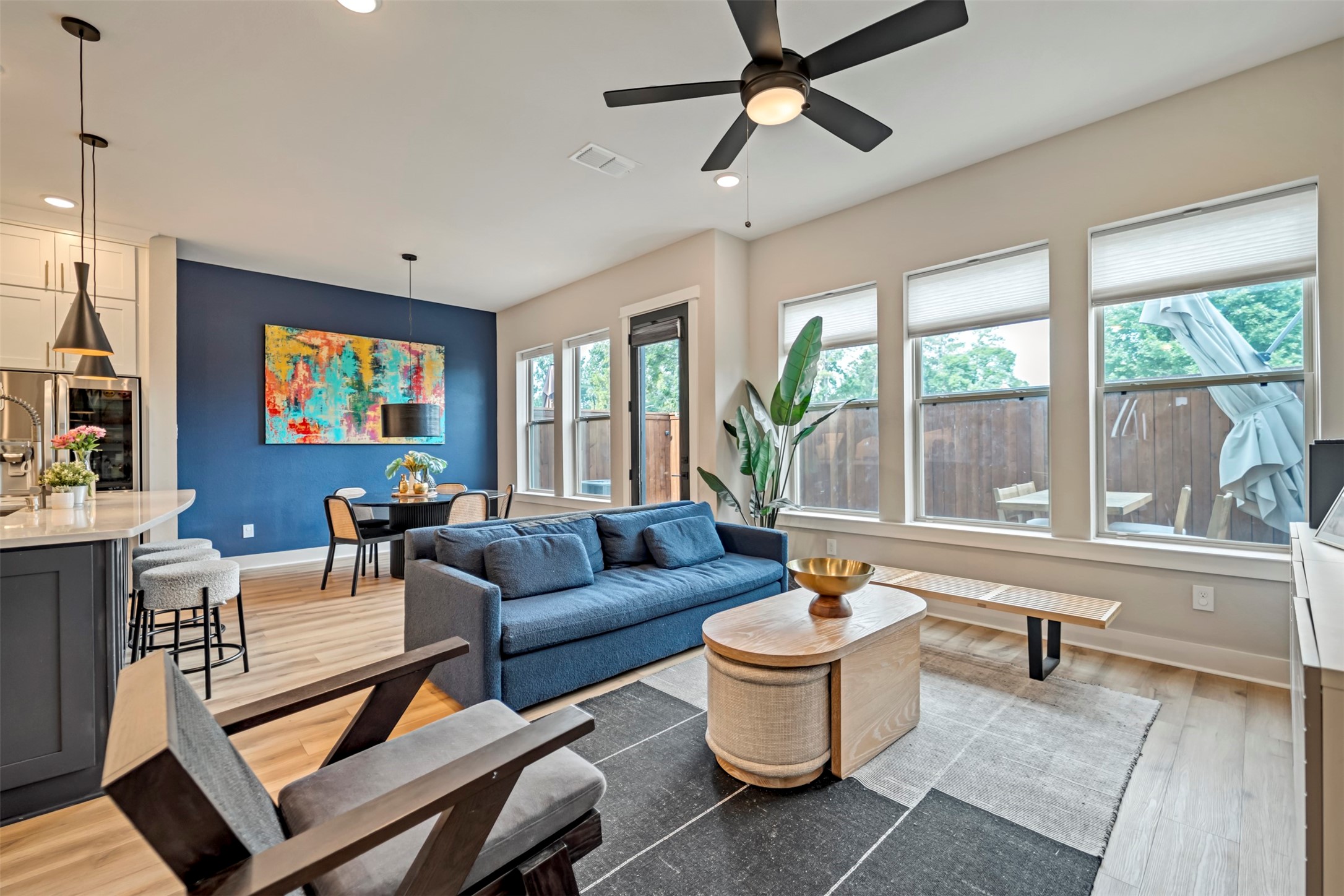 5209 Carters Bank Avenue Houston, TX 77091 - Photo 6 of 24 a living room with furniture a flat screen tv and a large window