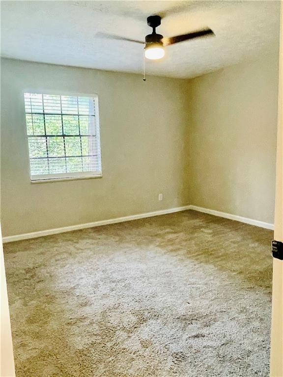 6434 Woodstone Way Morrow, GA 30260 - Photo 7 of 14 an empty room with a window