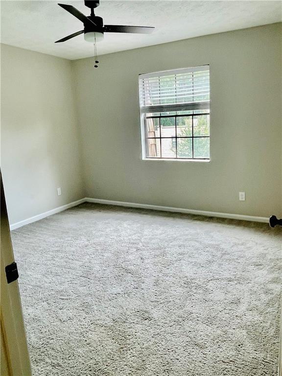 6434 Woodstone Way Morrow, GA 30260 - Photo 8 of 14 an empty room with a window