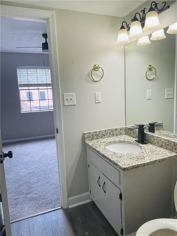 6434 Woodstone Way Morrow, GA 30260 - Photo 10 of 14 a bathroom with a granite countertop sink and a mirror