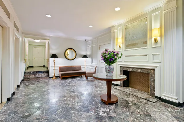 a living room with furniture flat screen tv and a fireplace