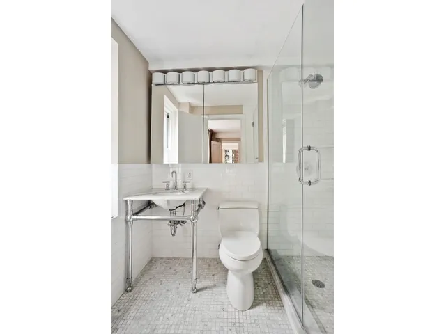 a kitchen with a white cabinets and white appliances