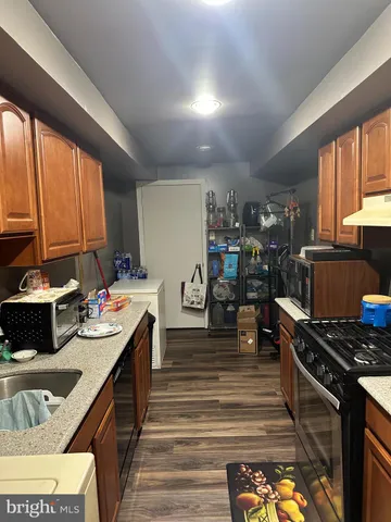 a kitchen with lots of counter top space and stainless steel appliances