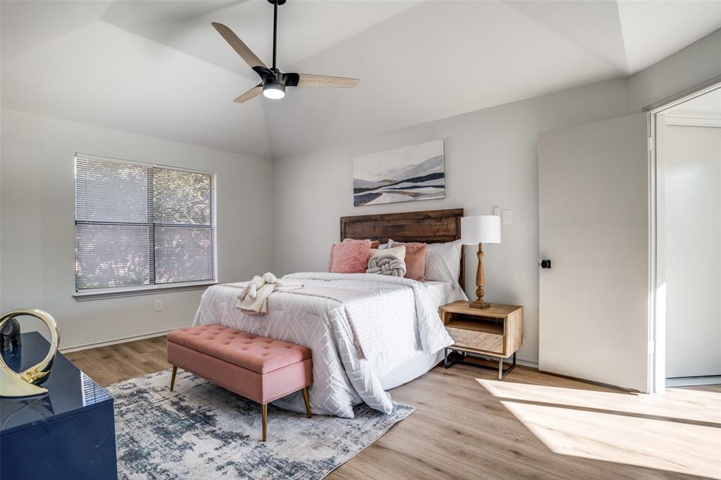 509 Rose Drive Allen, TX 75002 - Photo 16 of 25 a bedroom with a bed wooden floor and window