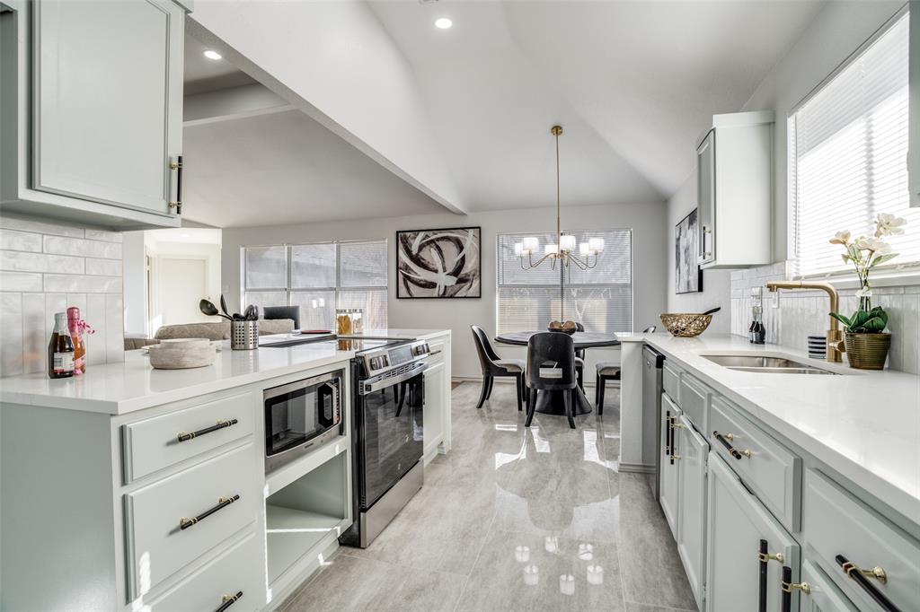 509 Rose Drive Allen, TX 75002 - Photo 9 of 25 a kitchen with lots of counter top space