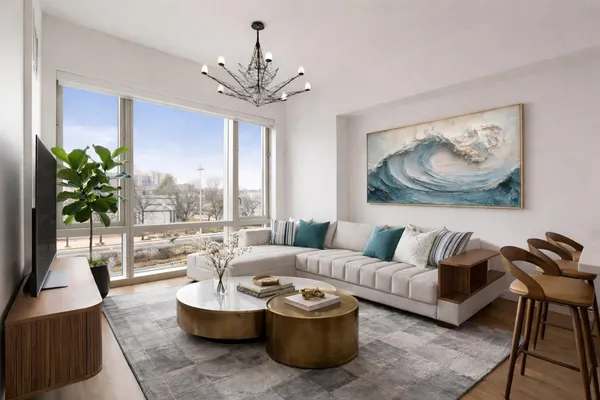 a living room with furniture and a large window