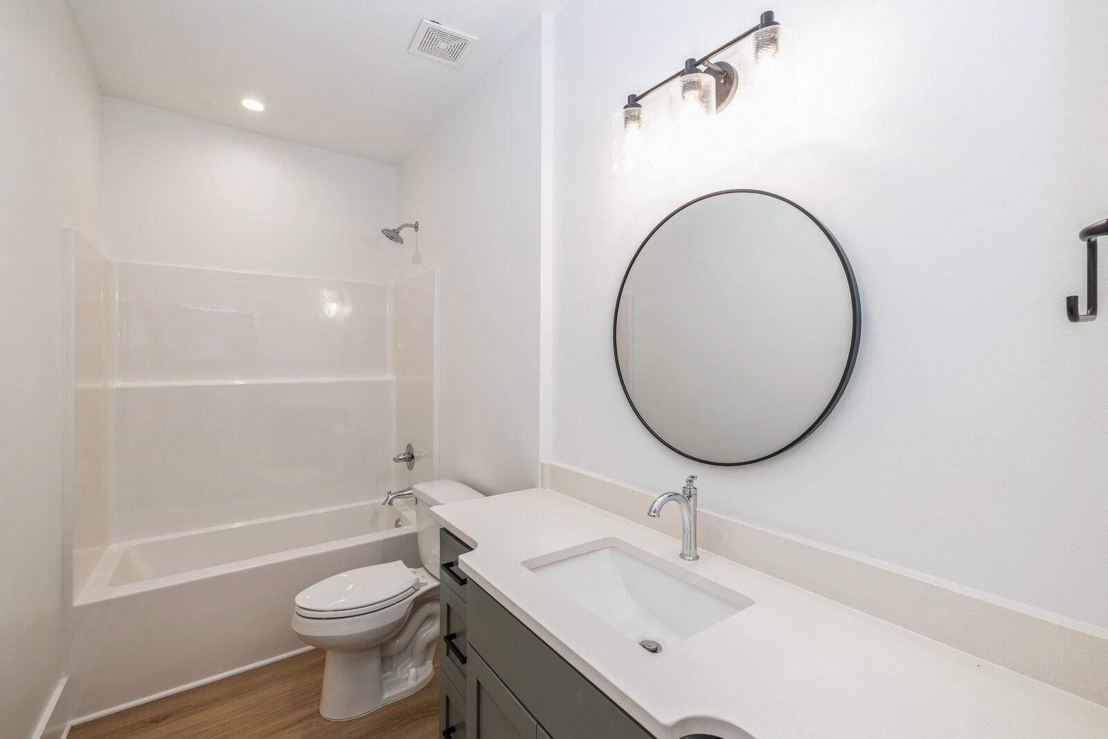 521 Brock Avenue Crestview, FL 32539 - Photo 13 of 16 a bathroom with a sink a toilet and a mirror