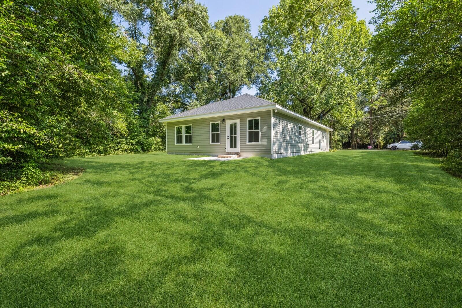 521 Brock Avenue Crestview, FL 32539 - Photo 2 of 16 a view of a house with a big yard