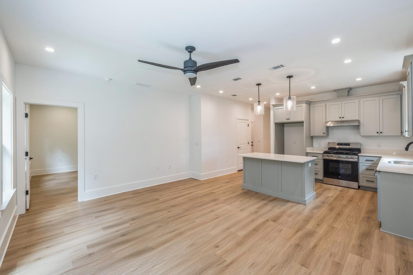 521 Brock Avenue Crestview, FL 32539 - Photo 6 of 16 a large kitchen with stainless steel appliances granite countertop a large counter top a sink and a refrigerator