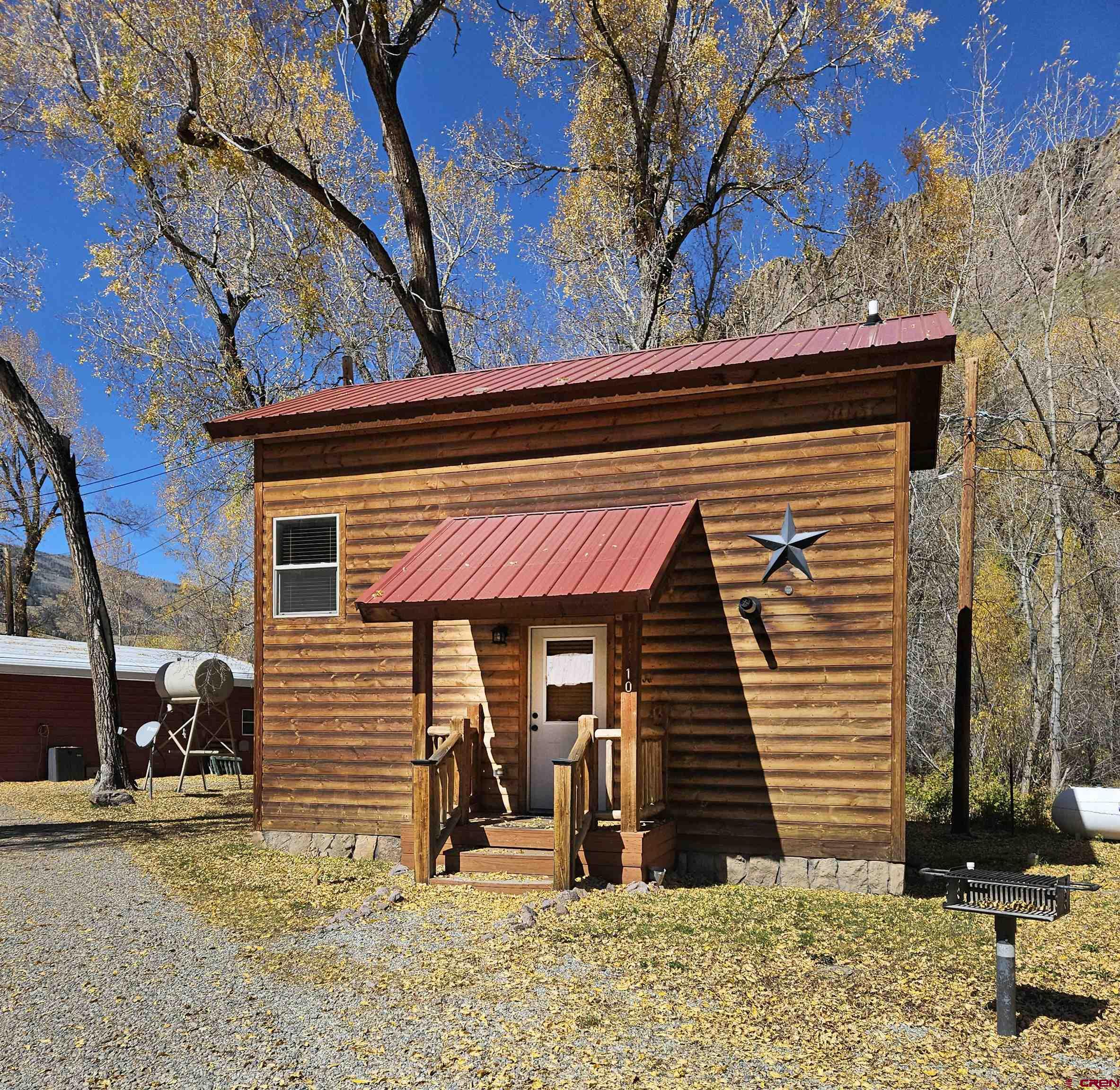 13046 Highway 149, Unit 10 Creede, CO 81130 - Photo 1 of 35 a front view of a house