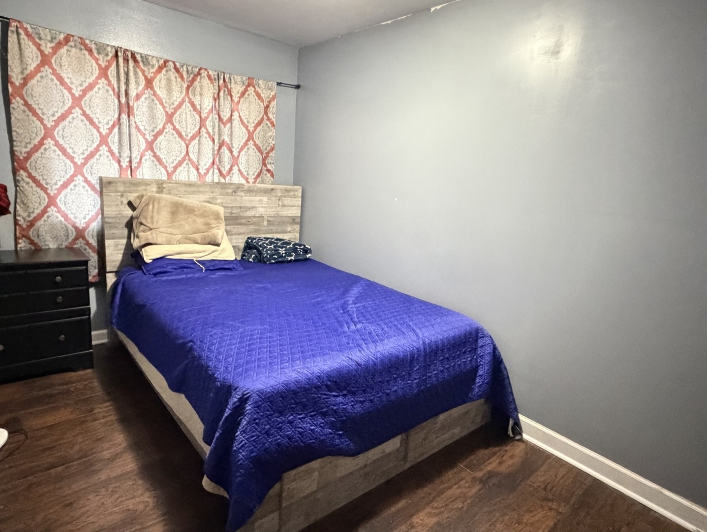 709 Hudson Avenue Romeoville, IL 60446 - Photo 11 of 16 a bed sitting in a bedroom next to a window