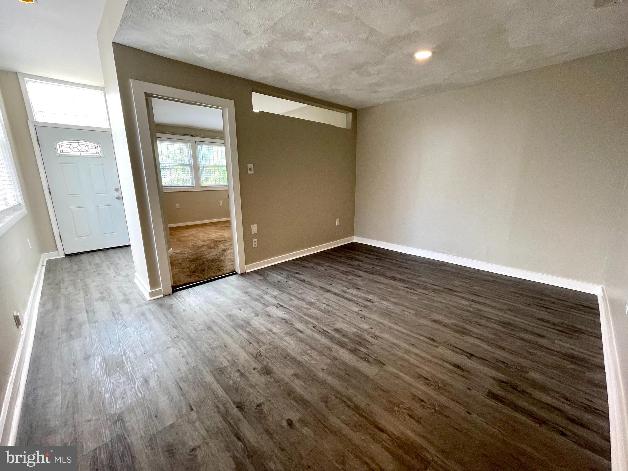 819 12th Street Northeast, Unit 1 Washington, DC 20002 - Photo 3 of 11 wooden floor in an empty room with a window
