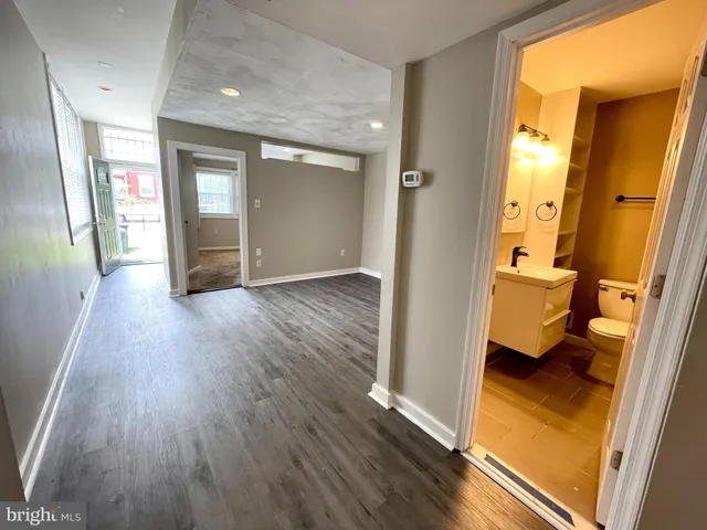 wooden floor with a bedroom
