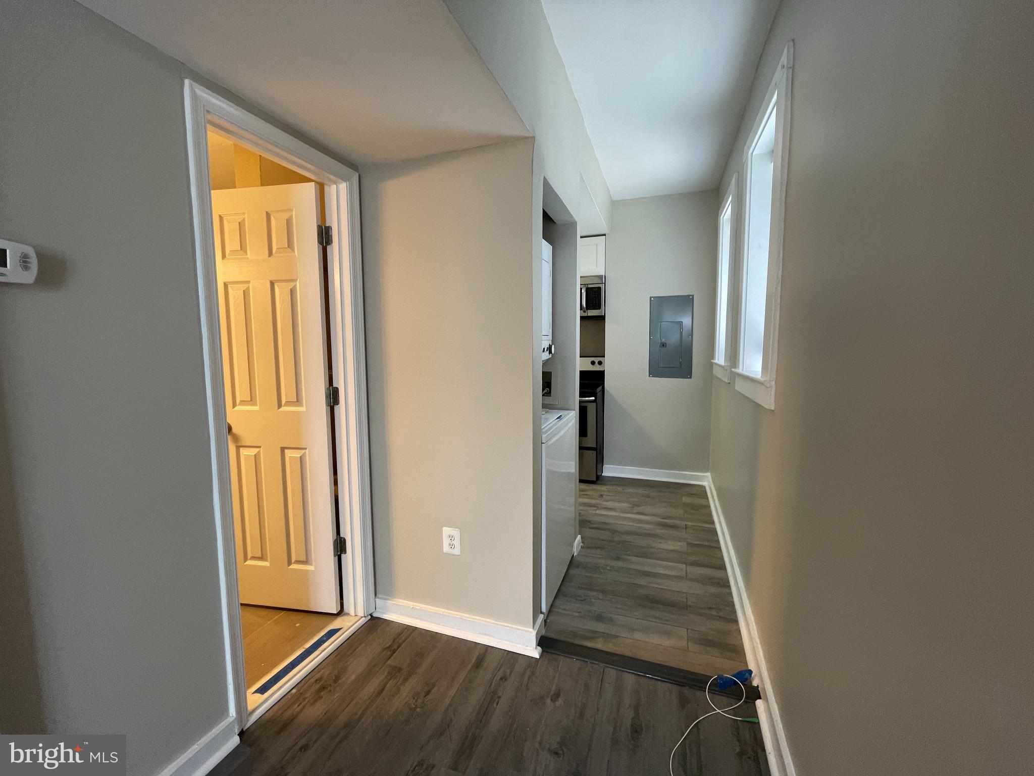 819 12th Street Northeast, Unit 1 Washington, DC 20002 - Photo 5 of 11 a view of a hallway with wooden floor and windows