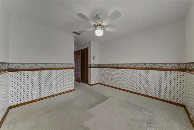a view of storage and utility room with racks on the wall