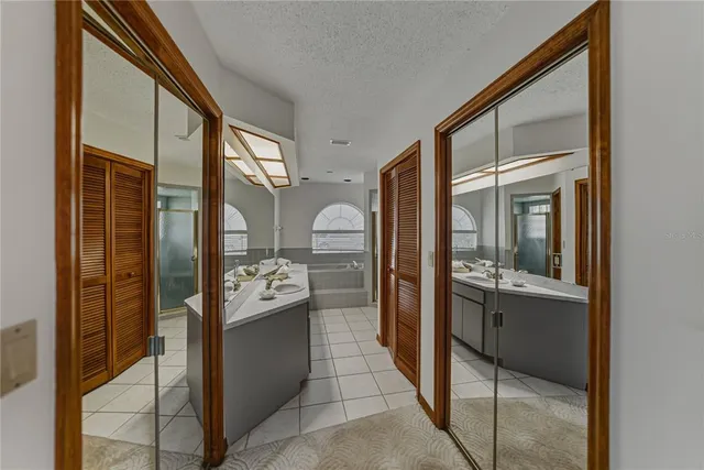 a view of a livingroom with a ceiling fan and window
