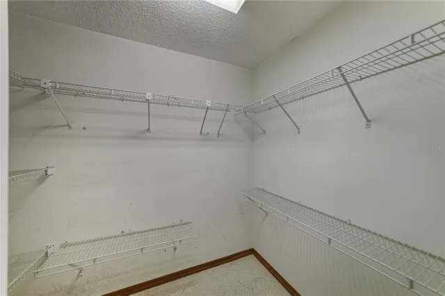 a kitchen with a sink window and cabinets