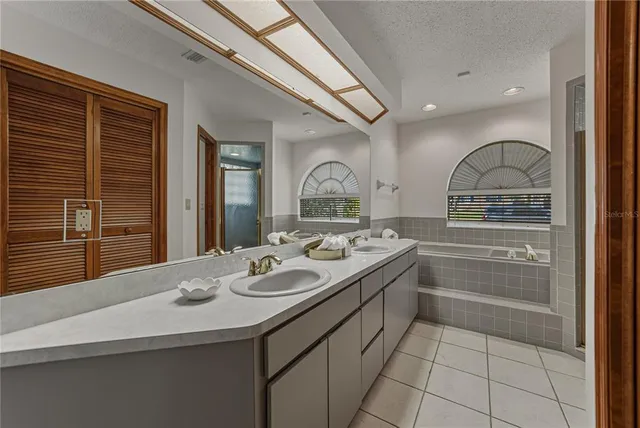 a kitchen with a stove a refrigerator and cabinets