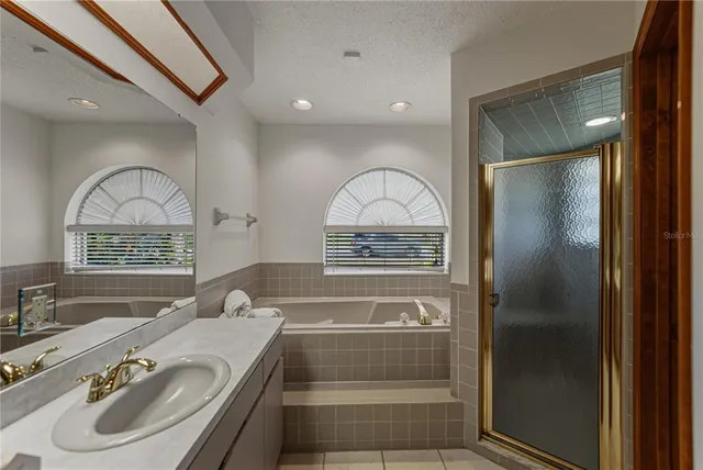 a view of empty room with wooden floor and fireplace