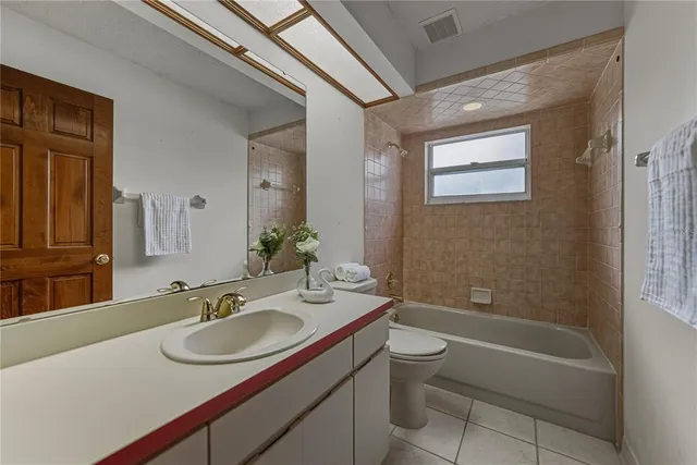 a view of a livingroom with furniture and a large window