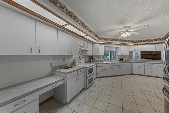 a view of a backyard with swimming pool