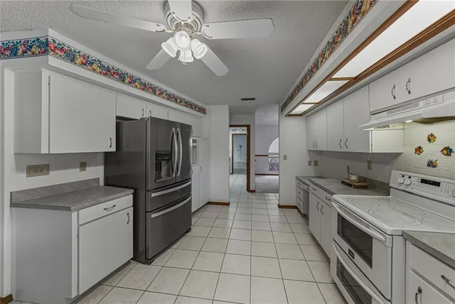 a view of a backyard with a wooden deck