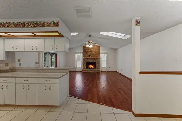 a view of a patio with a table and chairs under an umbrella