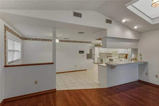 a view of a house with a yard and plants