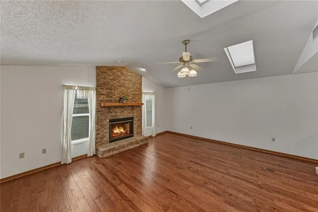 a view of a lake with houses in the back
