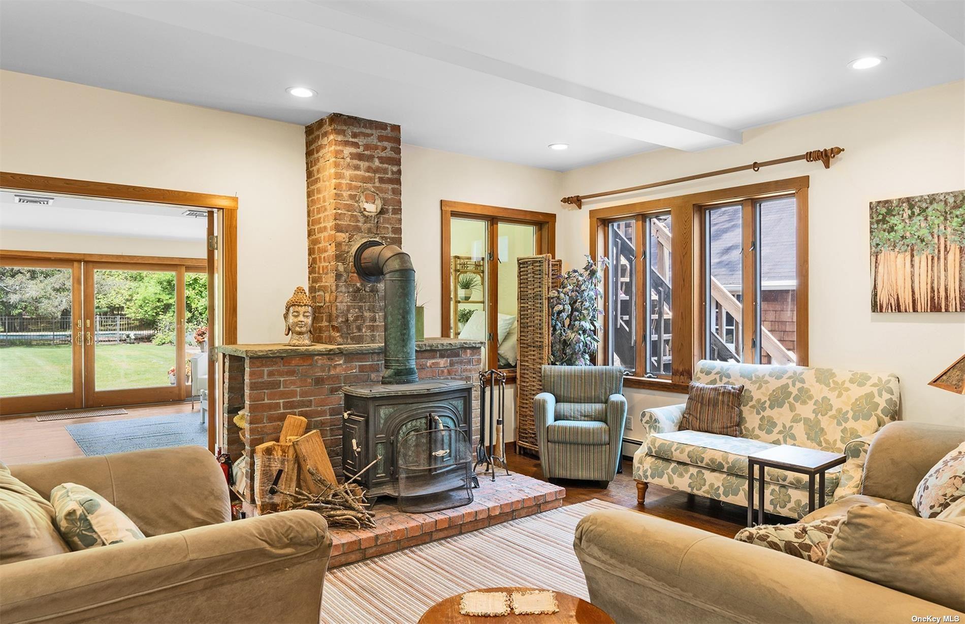 61 Lower 7 Ponds Road Water Mill, NY 11976 - Photo 14 of 43 a living room with furniture and a large window