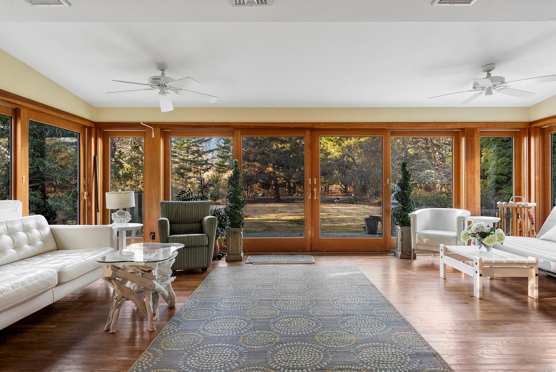 61 Lower 7 Ponds Road Water Mill, NY 11976 - Photo 23 of 43 a living room with furniture and a large window