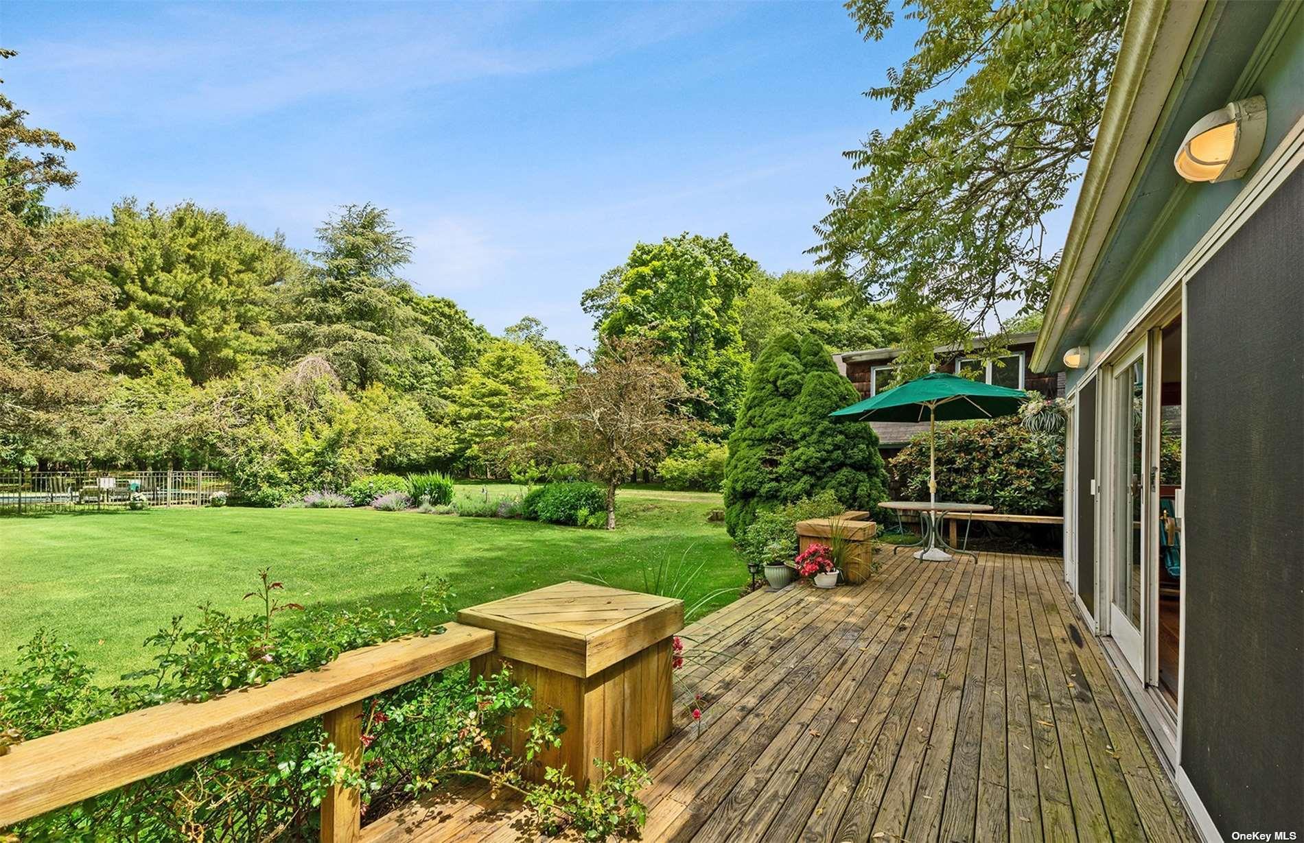 61 Lower 7 Ponds Road Water Mill, NY 11976 - Photo 25 of 43 a garden view with a seating space
