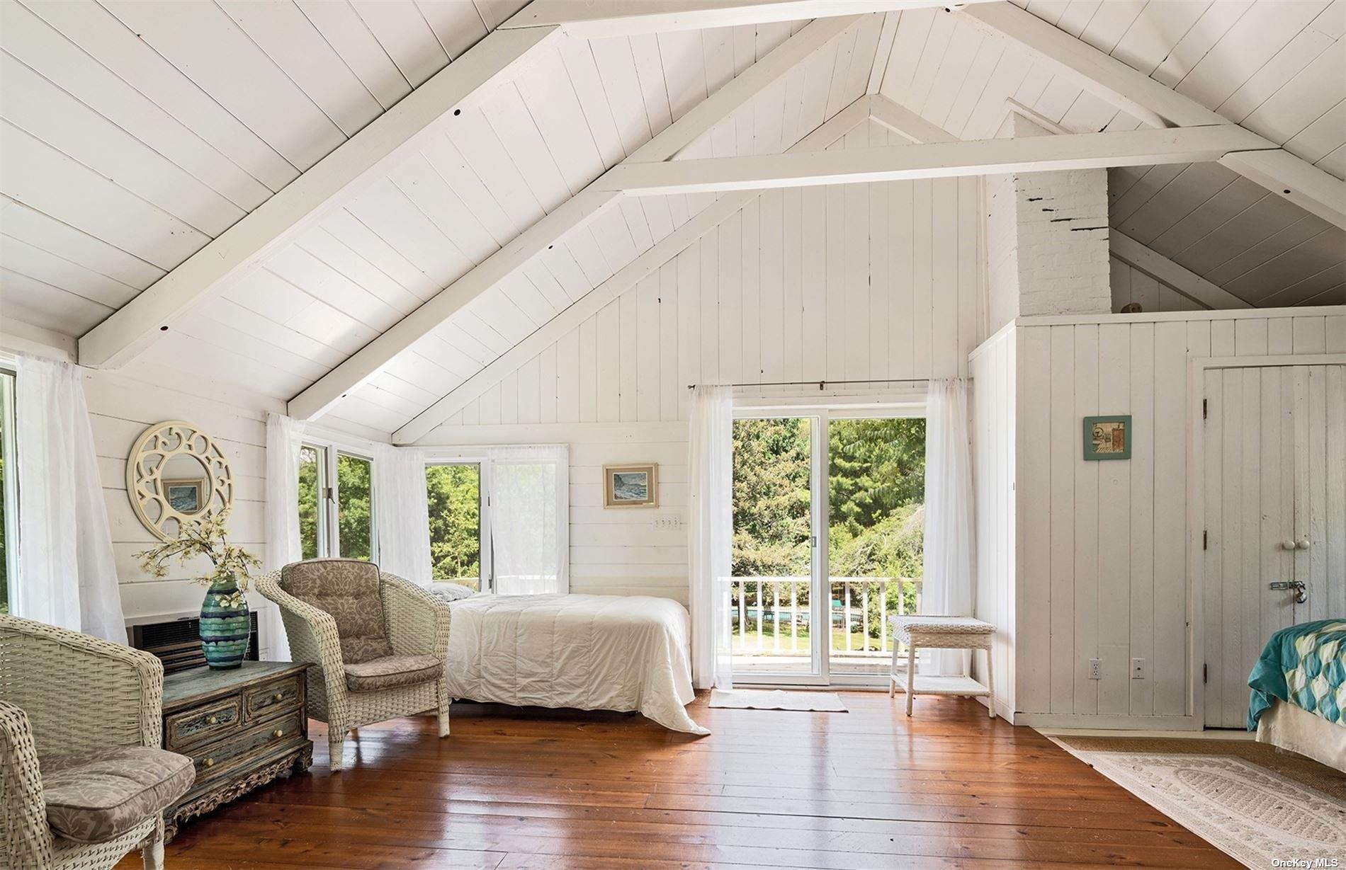 61 Lower 7 Ponds Road Water Mill, NY 11976 - Photo 29 of 43 a living room with furniture and a large window