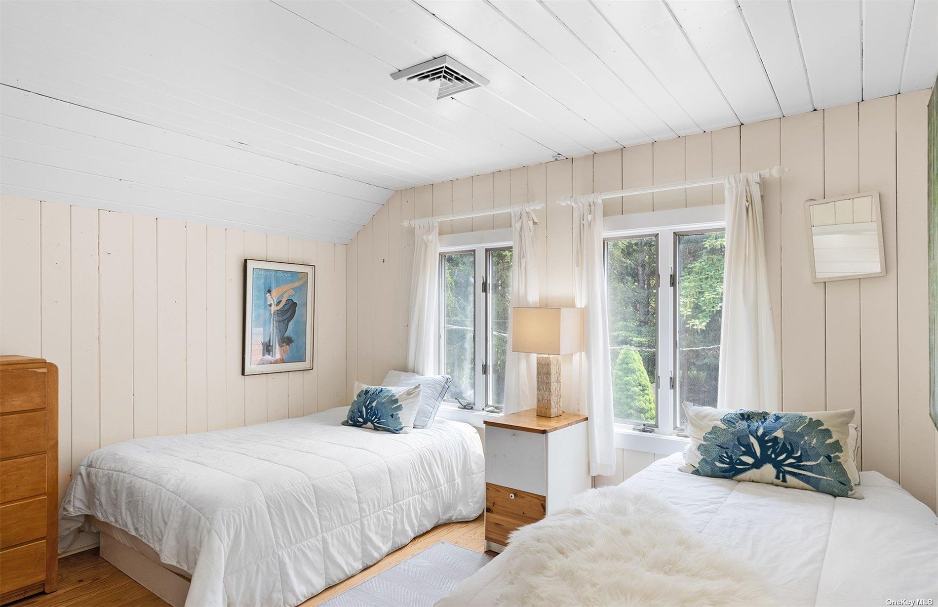 61 Lower 7 Ponds Road Water Mill, NY 11976 - Photo 31 of 43 a bedroom with a bed and a window