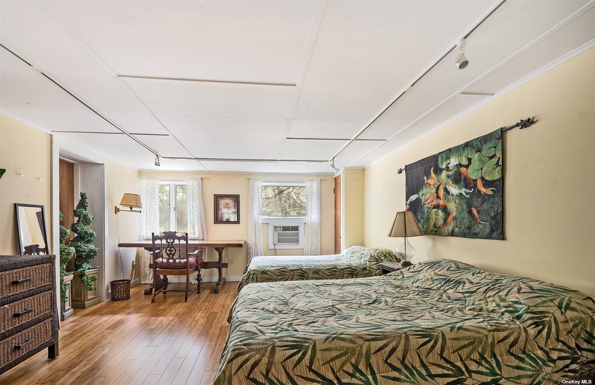 61 Lower 7 Ponds Road Water Mill, NY 11976 - Photo 32 of 43 a living room with furniture and wooden floor