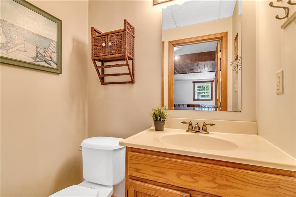 142 Waltz Mill Road Ruffs Dale, PA 15679 - Photo 36 of 47 a bathroom with a sink a toilet and mirror