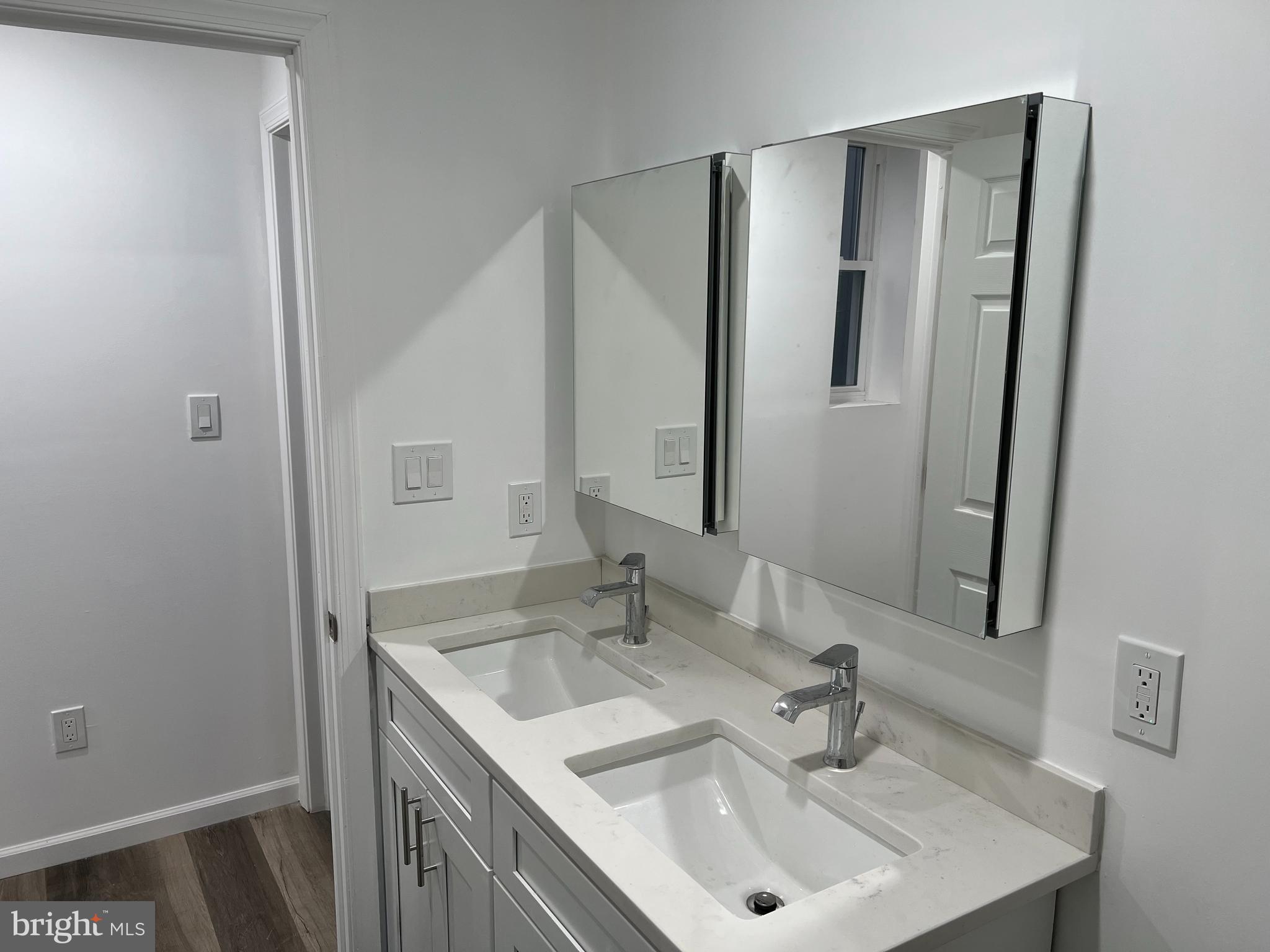 2814 Master Street, Unit B Philadelphia, PA 19121 - Photo 13 of 13 a bathroom with a sink and a mirror