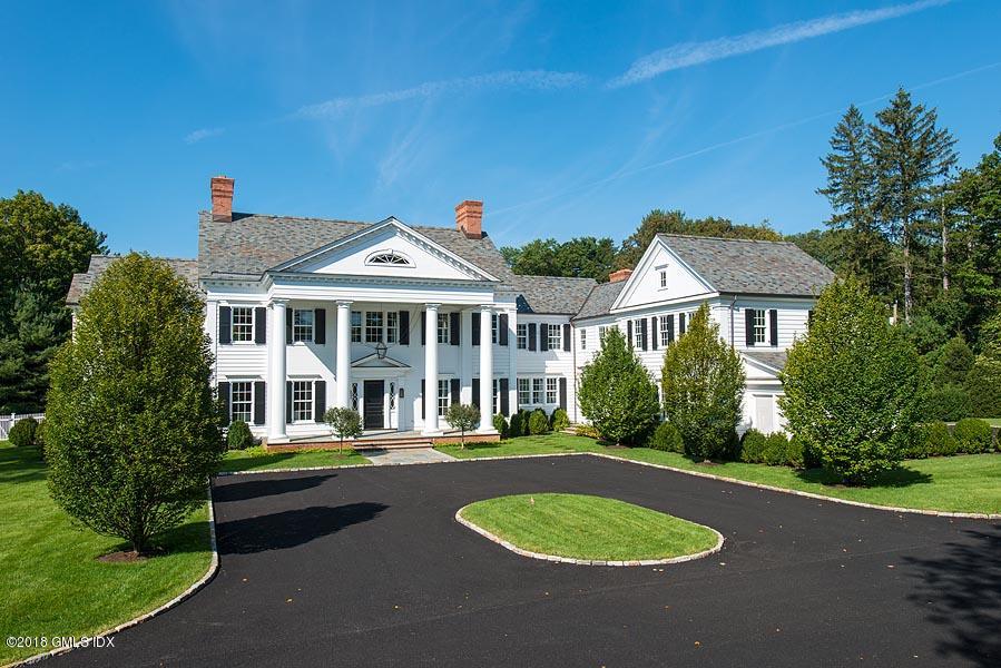 272 Round Hill Road Greenwich, CT 06831 - Photo 1 of 33 a front view of a house with a yard