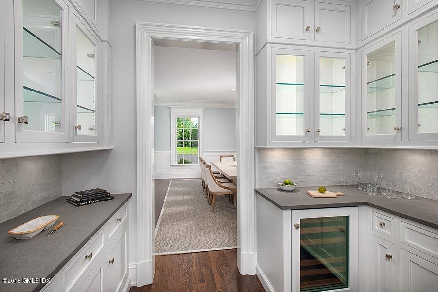 272 Round Hill Road Greenwich, CT 06831 - Photo 12 of 33 a kitchen with a white stove and cabinets