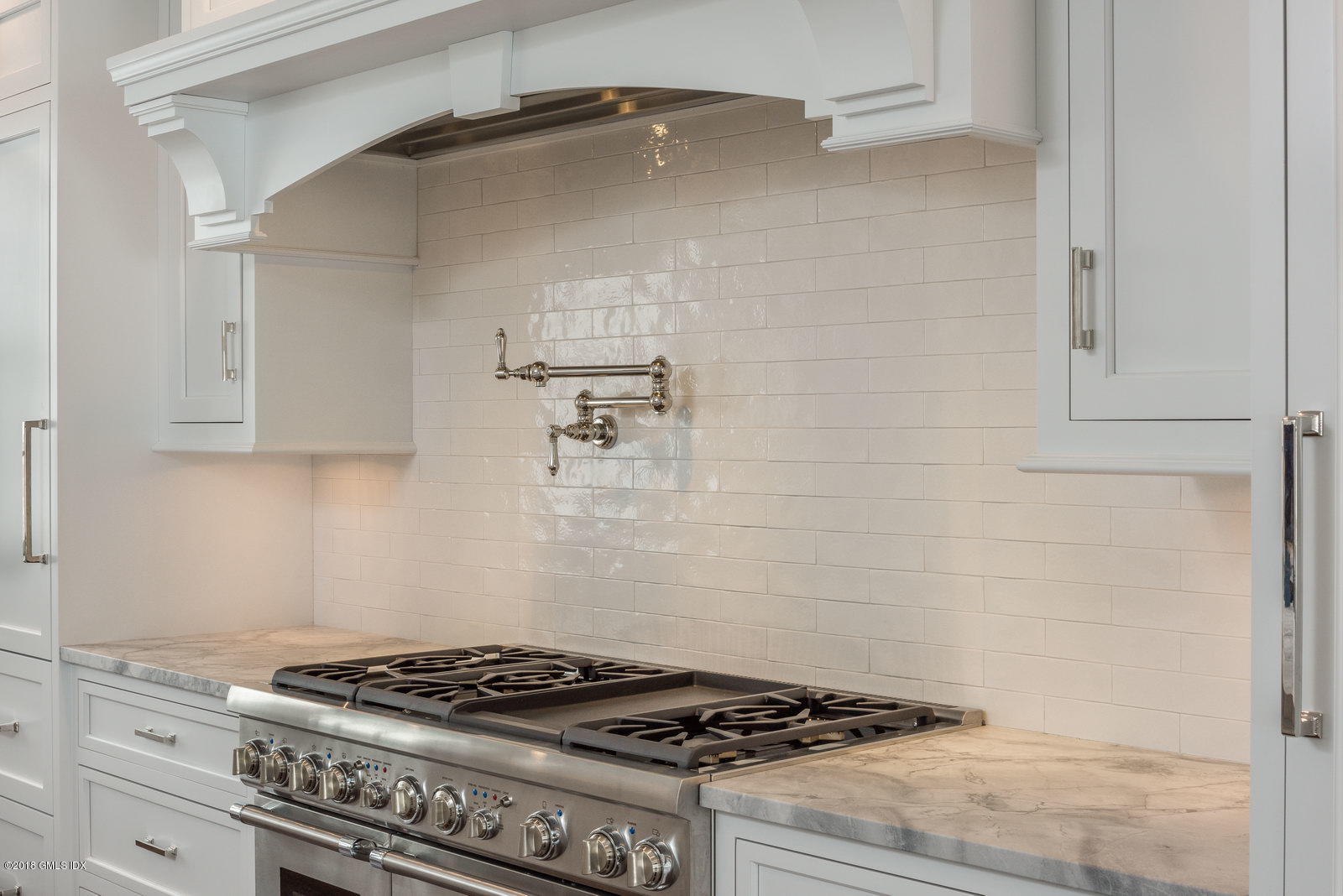 272 Round Hill Road Greenwich, CT 06831 - Photo 15 of 33 a stove top oven sitting inside of a kitchen