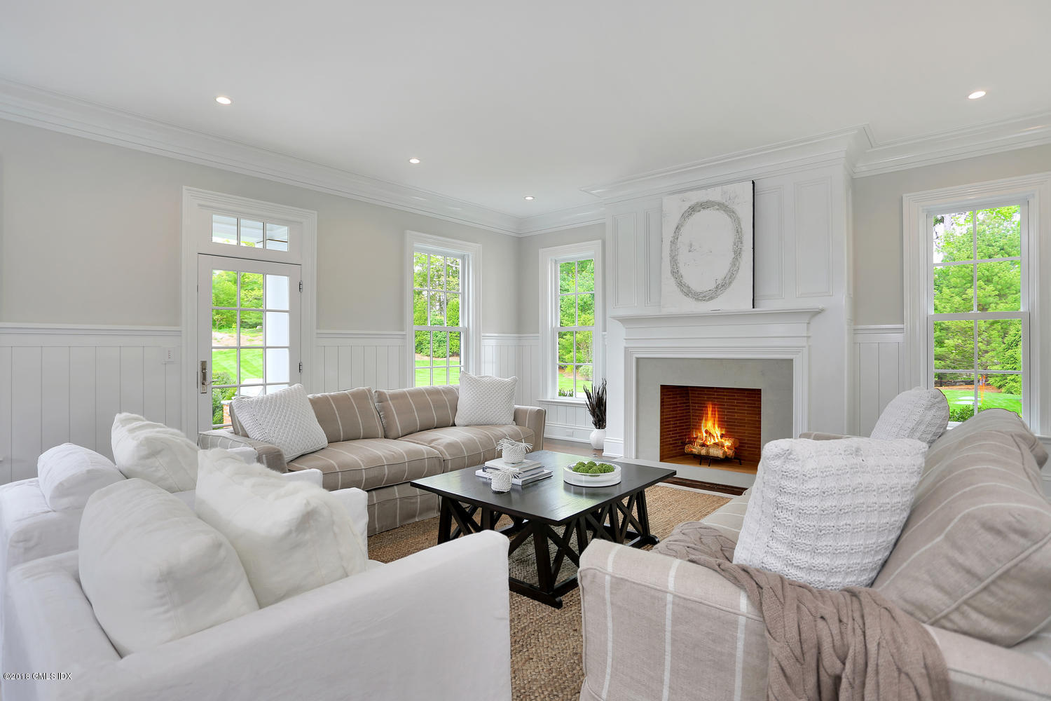 272 Round Hill Road Greenwich, CT 06831 - Photo 21 of 33 a living room with furniture and a fireplace
