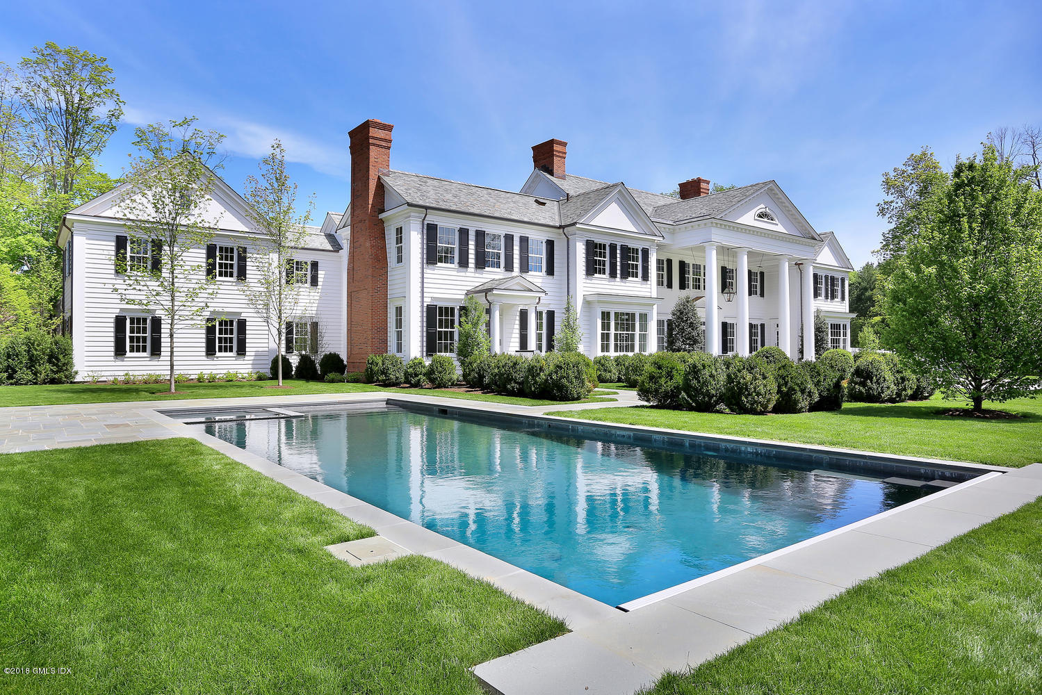 272 Round Hill Road Greenwich, CT 06831 - Photo 25 of 33 a view of a house with a swimming pool