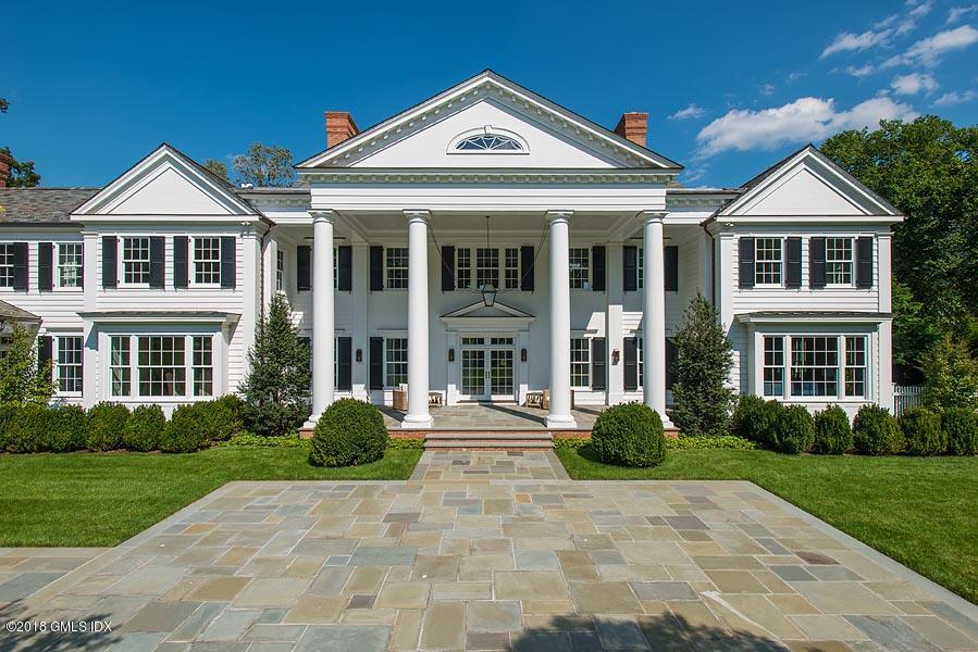 272 Round Hill Road Greenwich, CT 06831 - Photo 29 of 33 a front view of a house with a yard