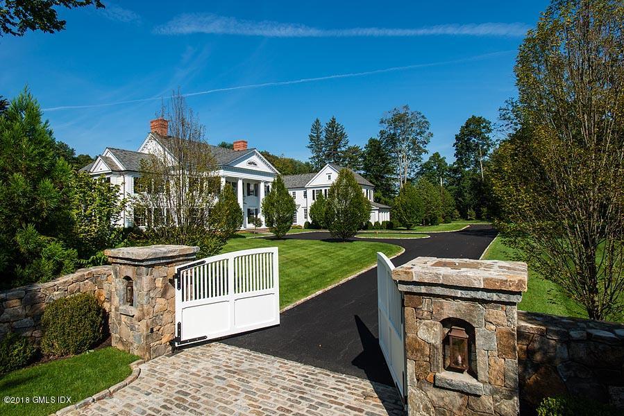 272 Round Hill Road Greenwich, CT 06831 - Photo 3 of 33 a view of a house with pool and yard
