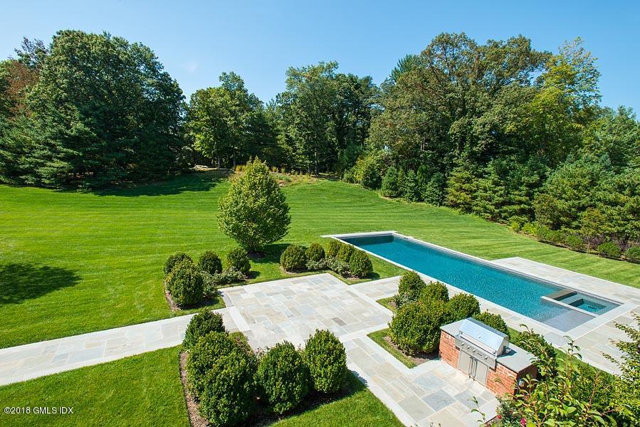 272 Round Hill Road Greenwich, CT 06831 - Photo 31 of 33 a view of a garden with a building in the background