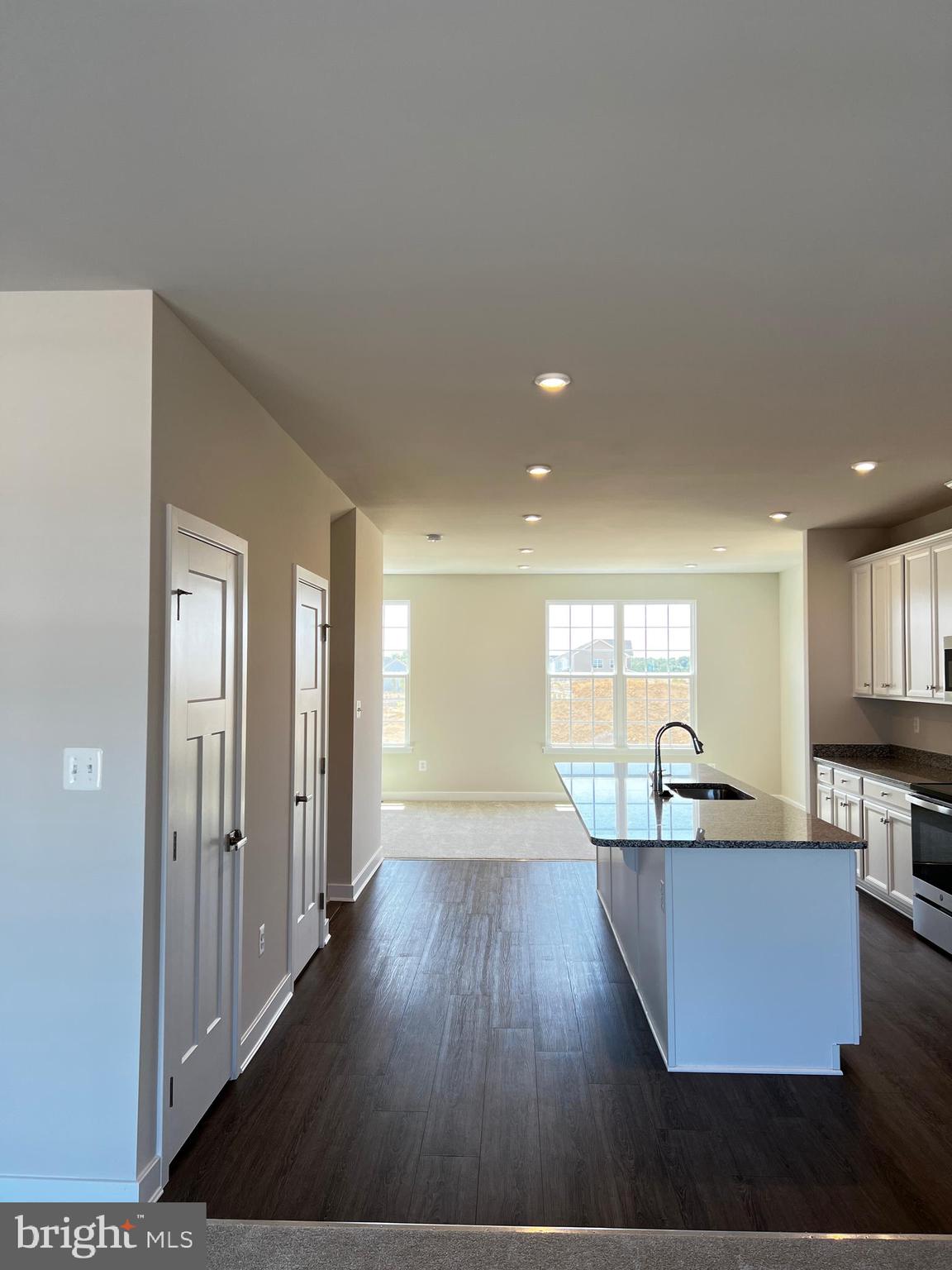 913 Ericcson Lane Middletown, DE 19709 - Photo 19 of 50 a living room with kitchen island granite countertop wooden floor and a sink