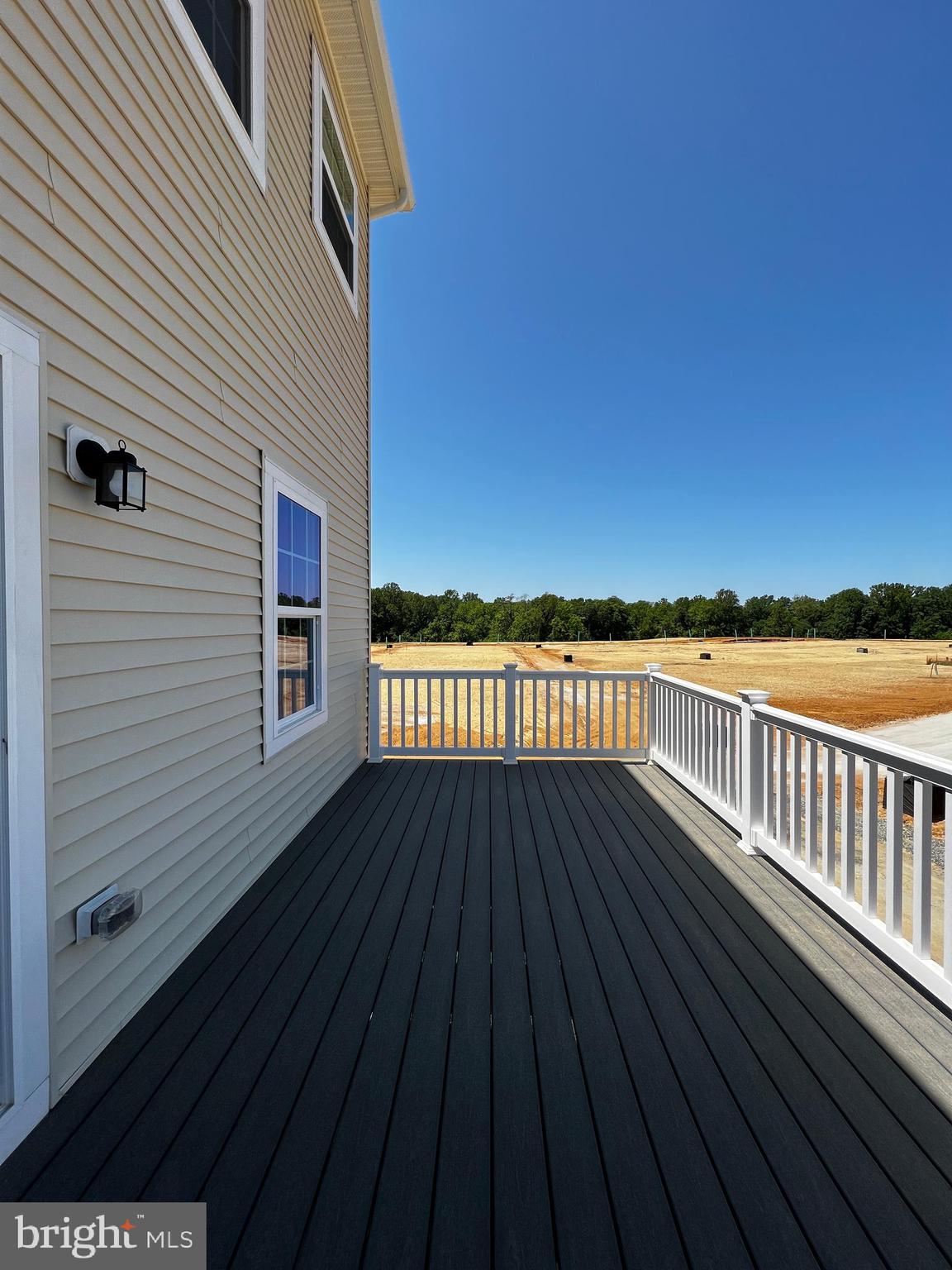 913 Ericcson Lane Middletown, DE 19709 - Photo 26 of 50 a view of balcony with wooden floor and fence