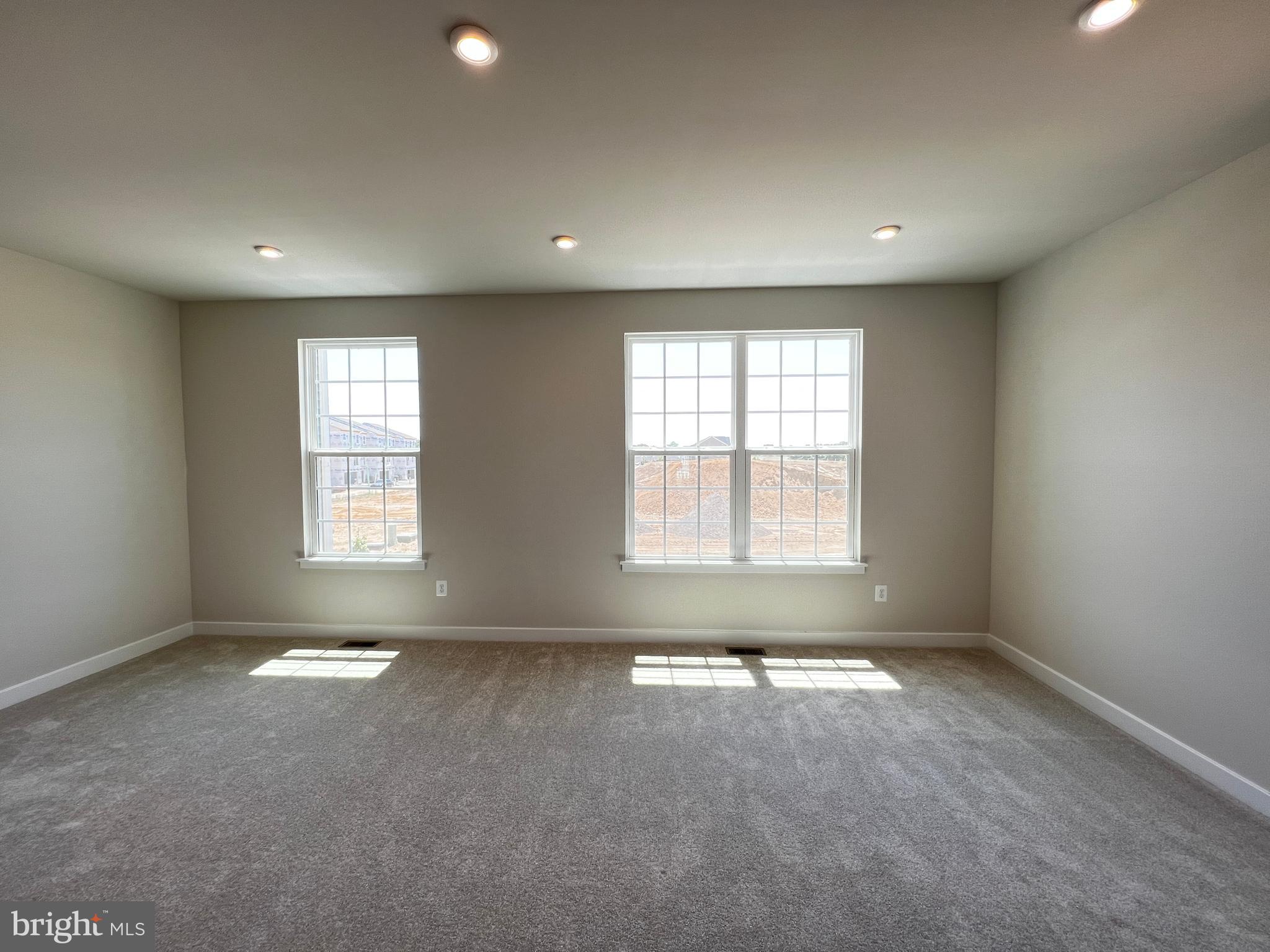 913 Ericcson Lane Middletown, DE 19709 - Photo 27 of 50 an empty room with windows and entrance